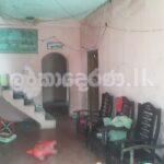 Land with half done two story house